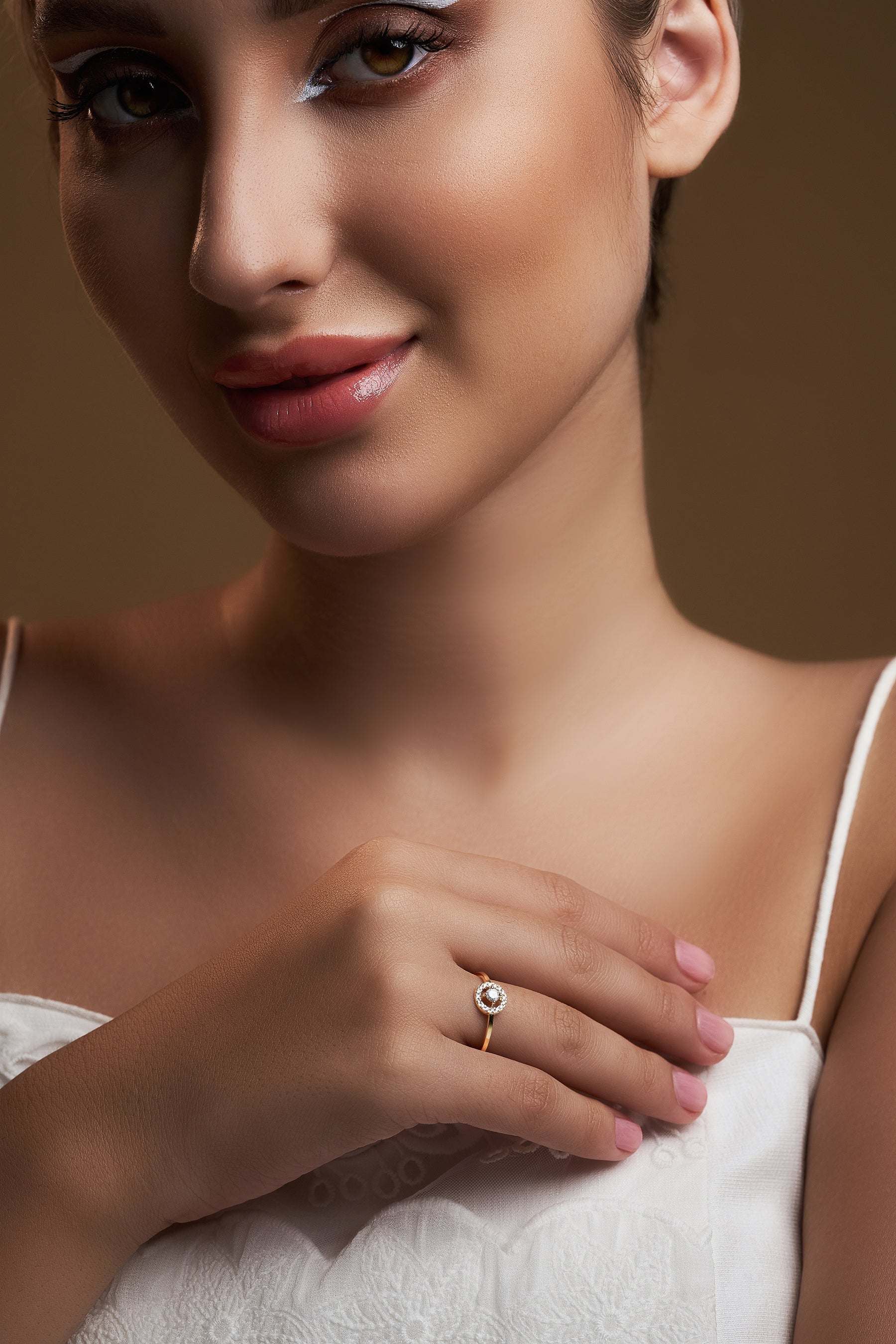 girl showing small diamond ring